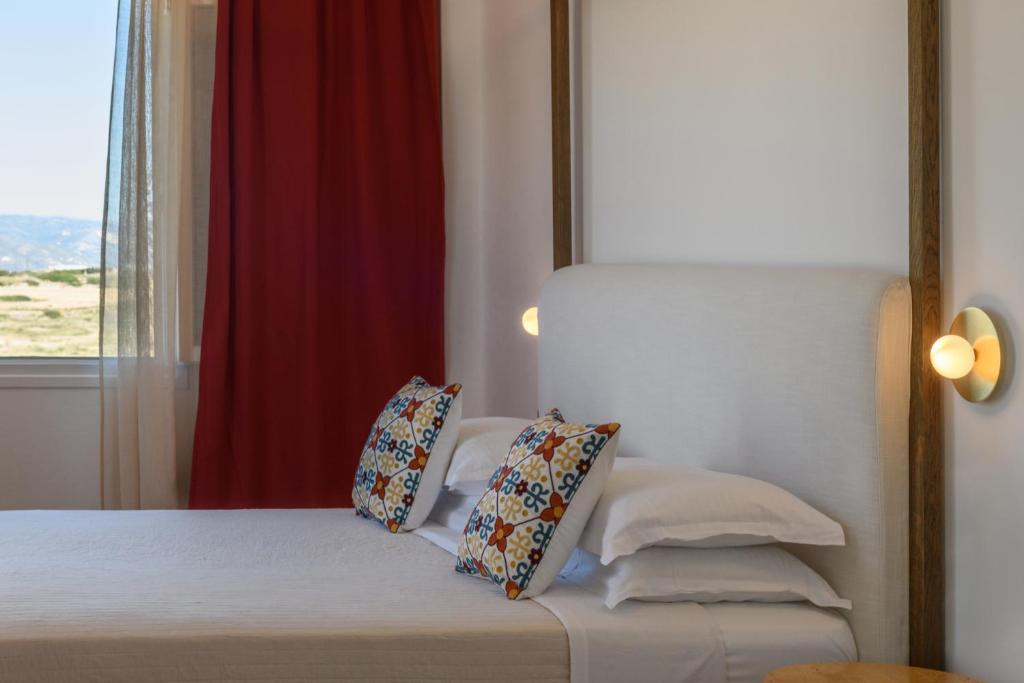 Postel nebo postele na pokoji v ubytování Kallisti Paros