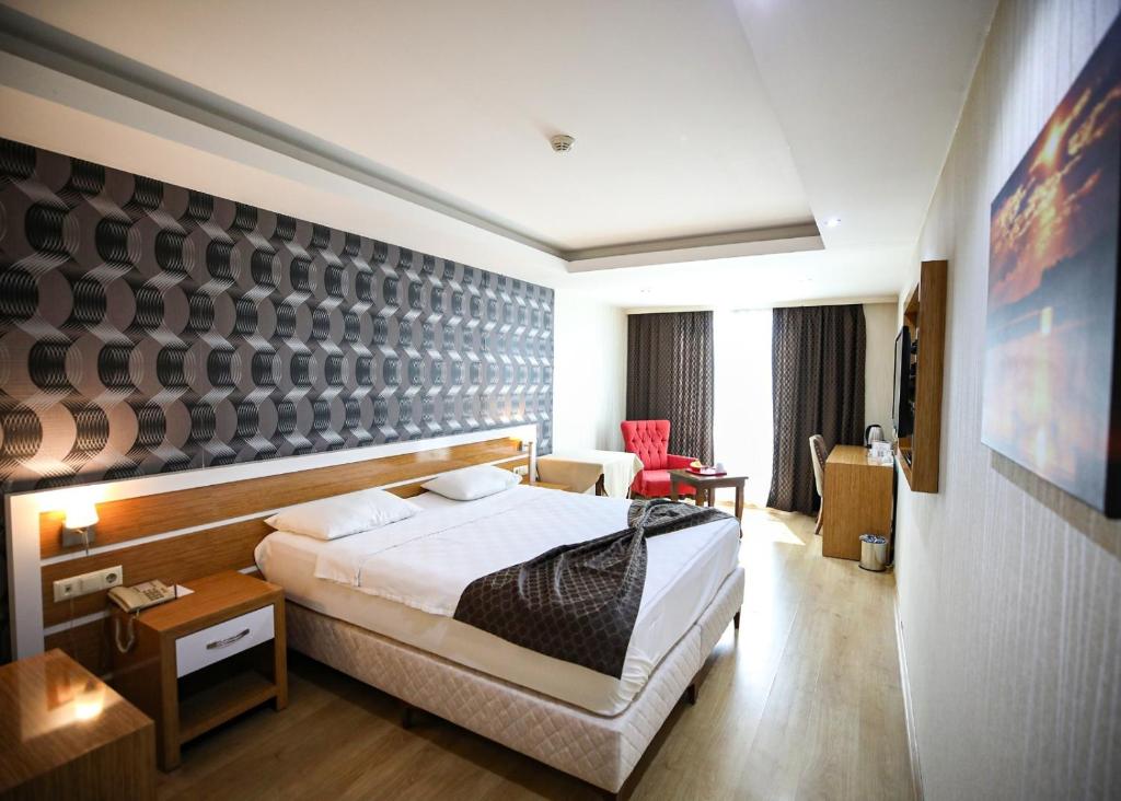 A bed or beds in a room at Bayazıt Hotel