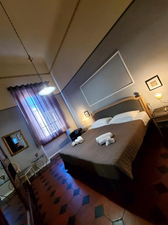 Postel nebo postele na pokoji v ubytování Hotel Fedora