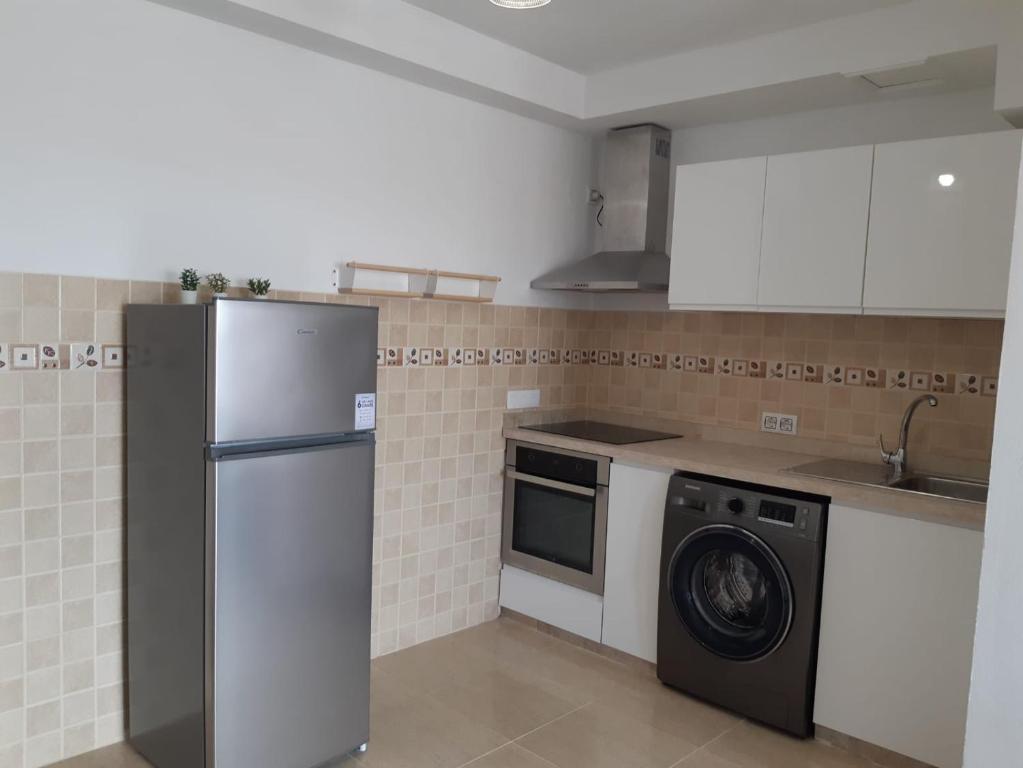 Kuchyň nebo kuchyňský kout v ubytování Apartamentos Cotillo Family