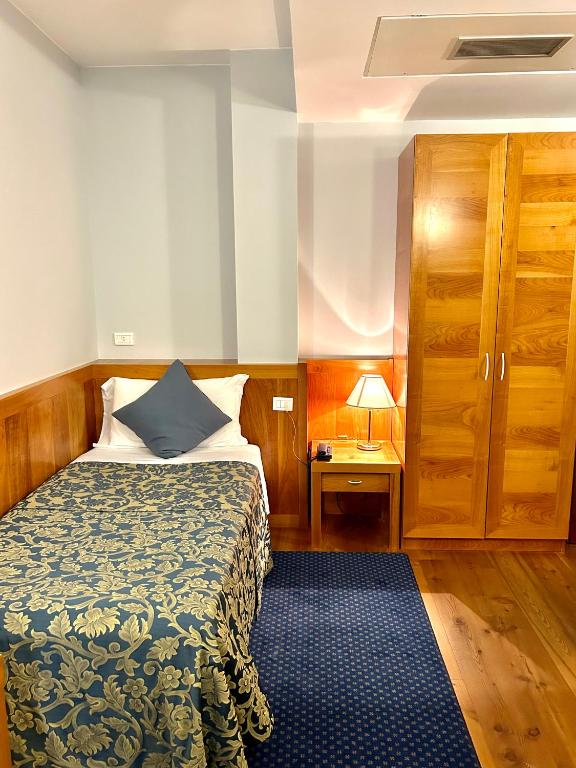 Postel nebo postele na pokoji v ubytování Hotel Due Torri Tempesta