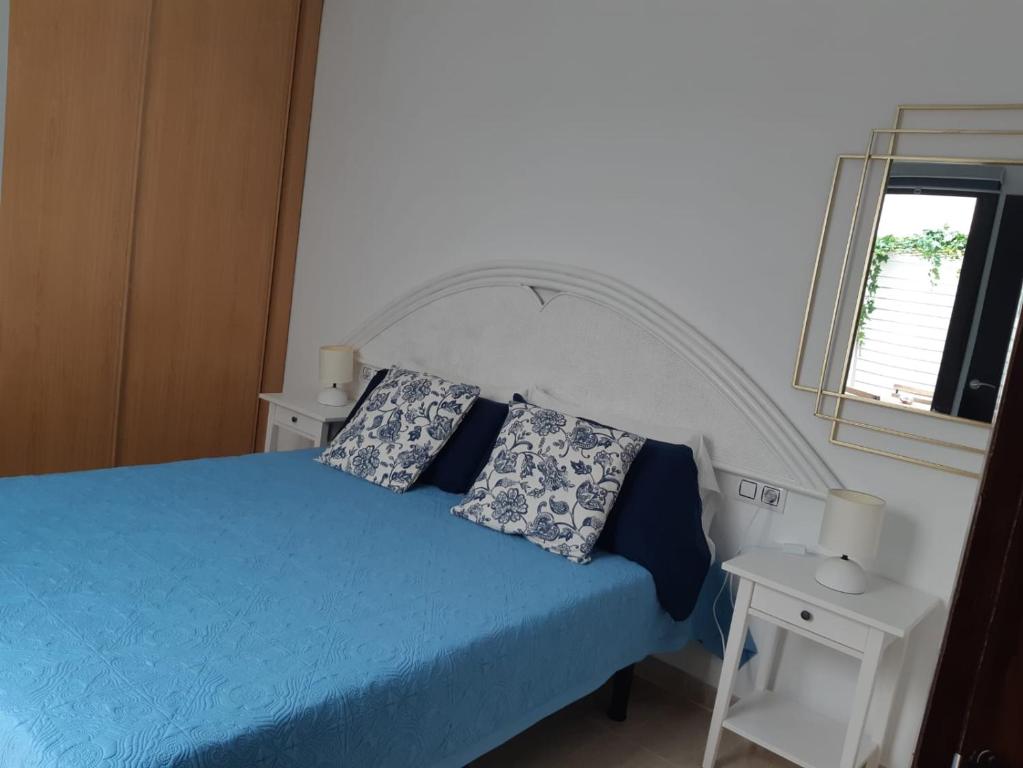 Postel nebo postele na pokoji v ubytování Apartamentos Cotillo Family