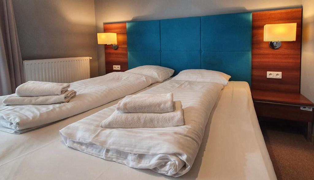 Posteľ alebo postele v izbe v ubytovaní Holiday Home Aparthotel z balkonem przy plaży