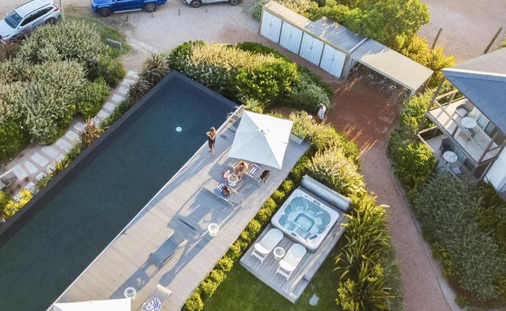 an aerial view of a house with a swimming pool at Anastasio Hotel & Beach Club in José Ignacio