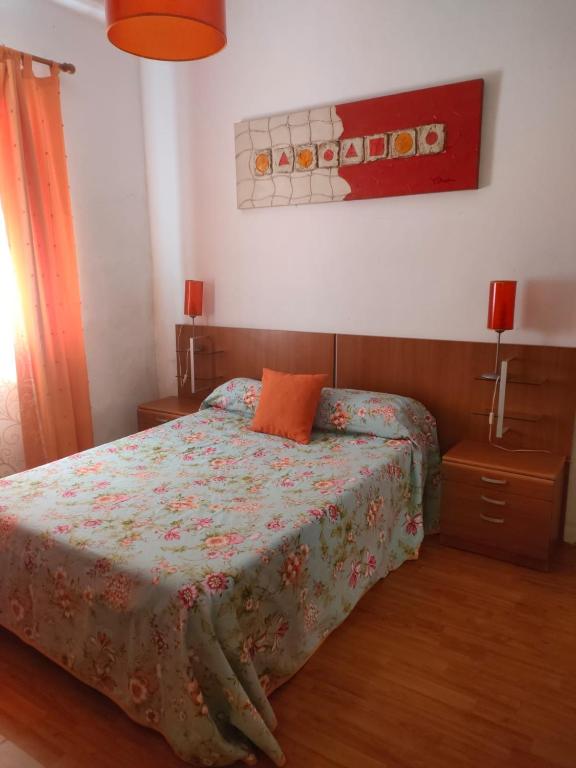 Posteľ alebo postele v izbe v ubytovaní APARTAMENTO LIBERTY