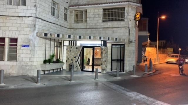 a building on a city street at night at Mount of Olives Hotel in Jerusalem