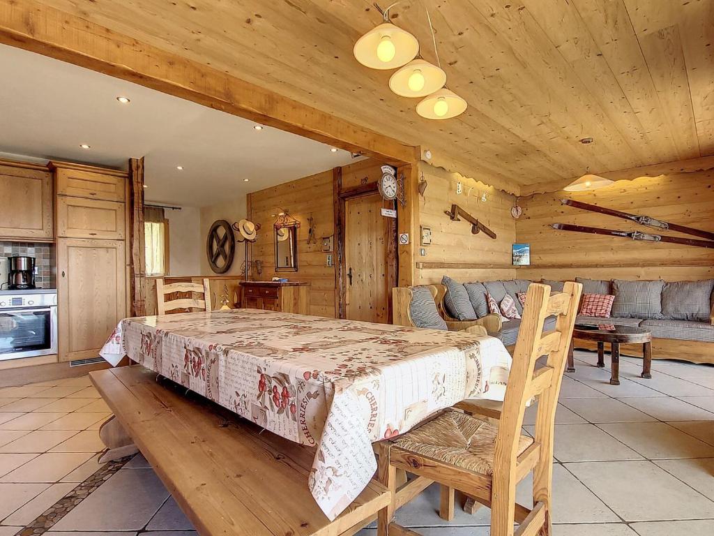 a bedroom with a large bed in a wooden room at Appartement La Toussuire, 5 pièces, 10 personnes - FR-1-417-72 in La Toussuire