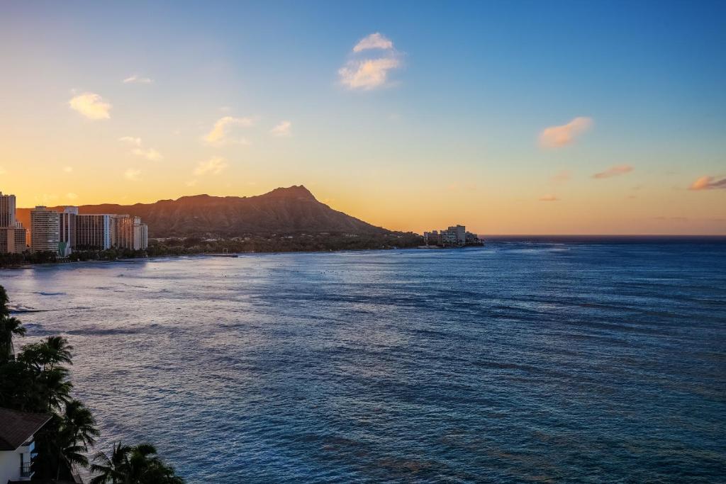 a view of the ocean with a mountain in the background at Castle Waikīkī Shore in Honolulu