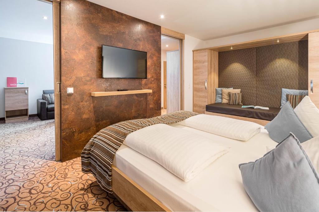 Postel nebo postele na pokoji v ubytování Seehotel Das JO