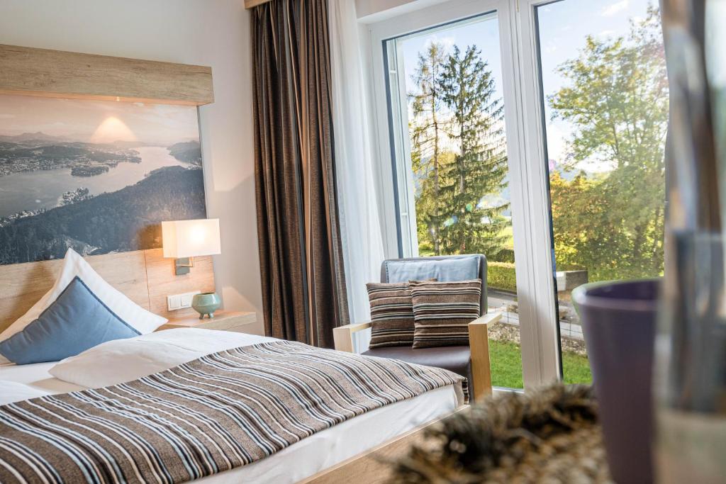 Postel nebo postele na pokoji v ubytování Seehotel Das JO