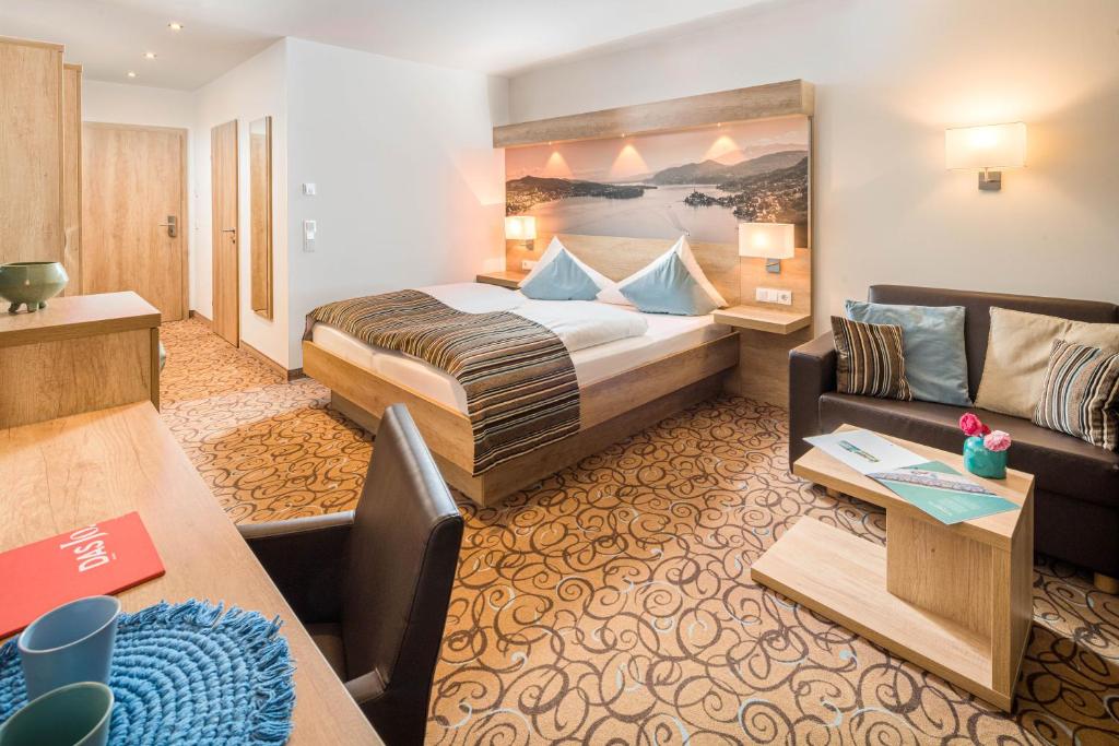 Postel nebo postele na pokoji v ubytování Seehotel Das JO