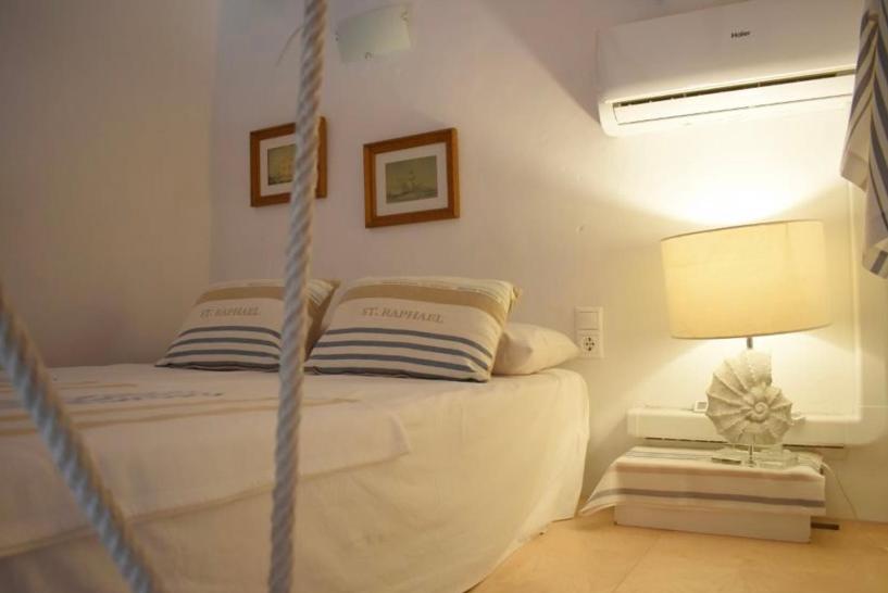 Postel nebo postele na pokoji v ubytování Isla de Tabarca: Casa Trinacria