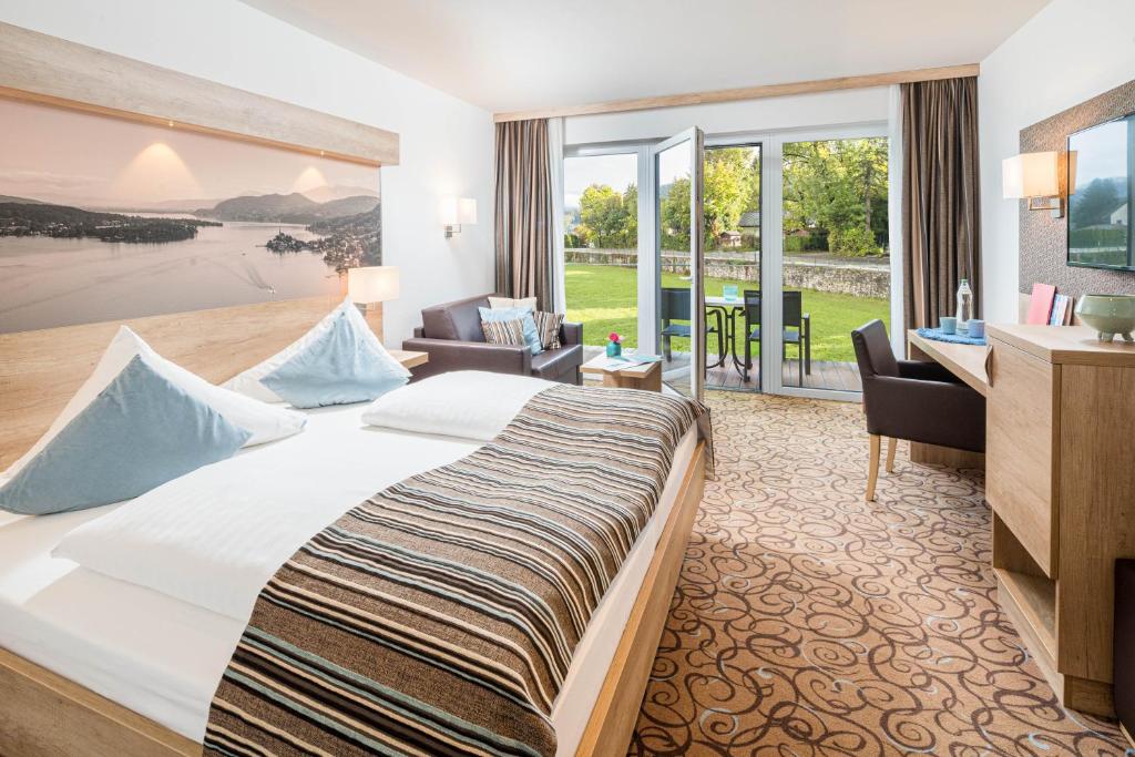 Postel nebo postele na pokoji v ubytování Seehotel Das JO