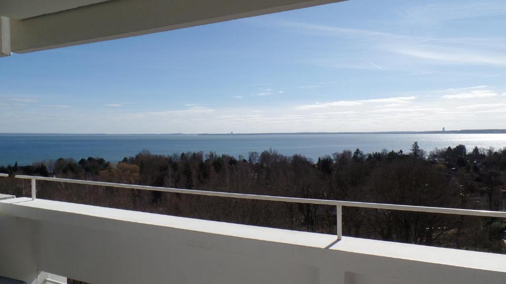 a balcony with a view of the water at Panoramic App A07-6 in Sierksdorf