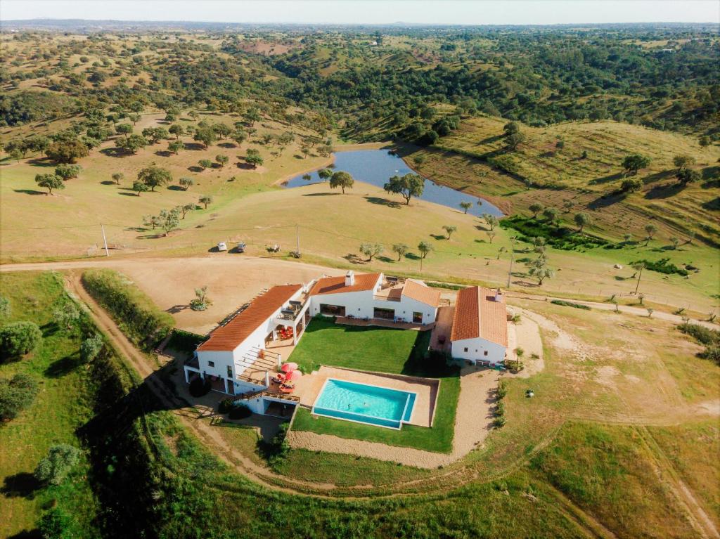 an aerial view of a house with a swimming pool at Agroturismo Flores do Campo in Vila Verde de Ficalho