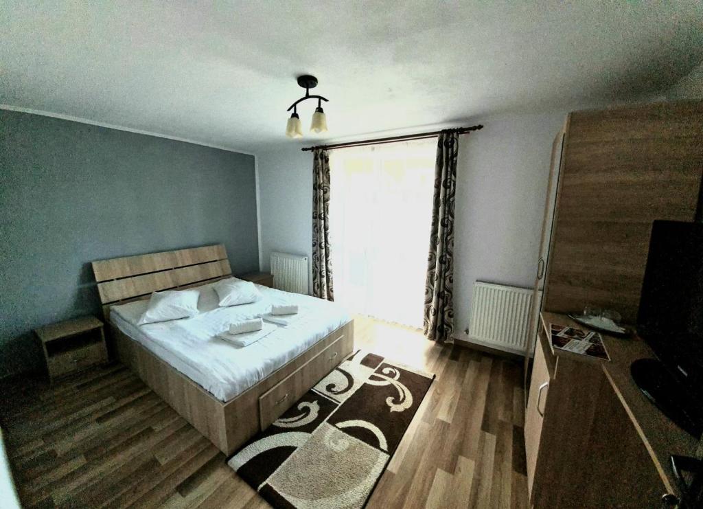 Postel nebo postele na pokoji v ubytování Casa Ostrov