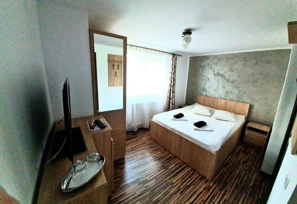 Postel nebo postele na pokoji v ubytování Casa Ostrov