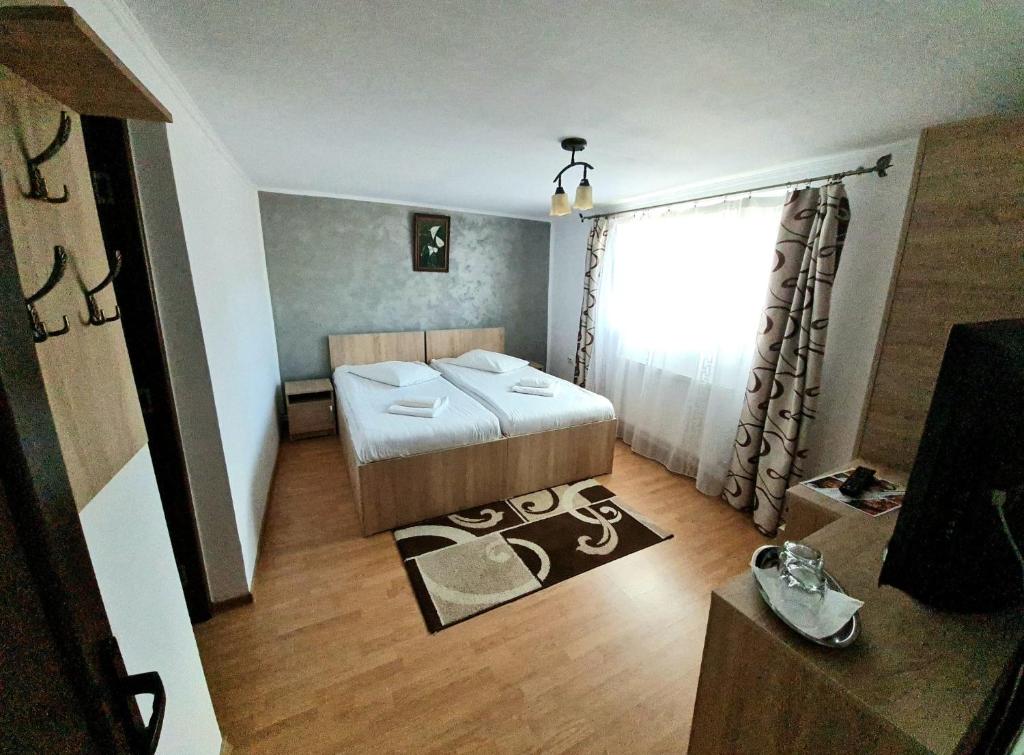 Postel nebo postele na pokoji v ubytování Casa Ostrov