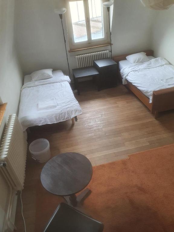 Letto o letti in una camera di Sonnegg Guest Rooms Inh M Bisegger