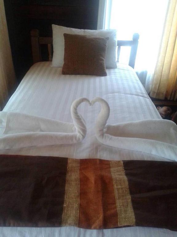 Postel nebo postele na pokoji v ubytování Burilamplai Resort บุรีลำปลาย รีสอร์ท
