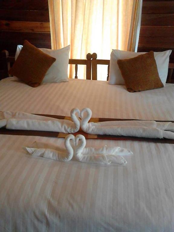 Postel nebo postele na pokoji v ubytování Burilamplai Resort บุรีลำปลาย รีสอร์ท