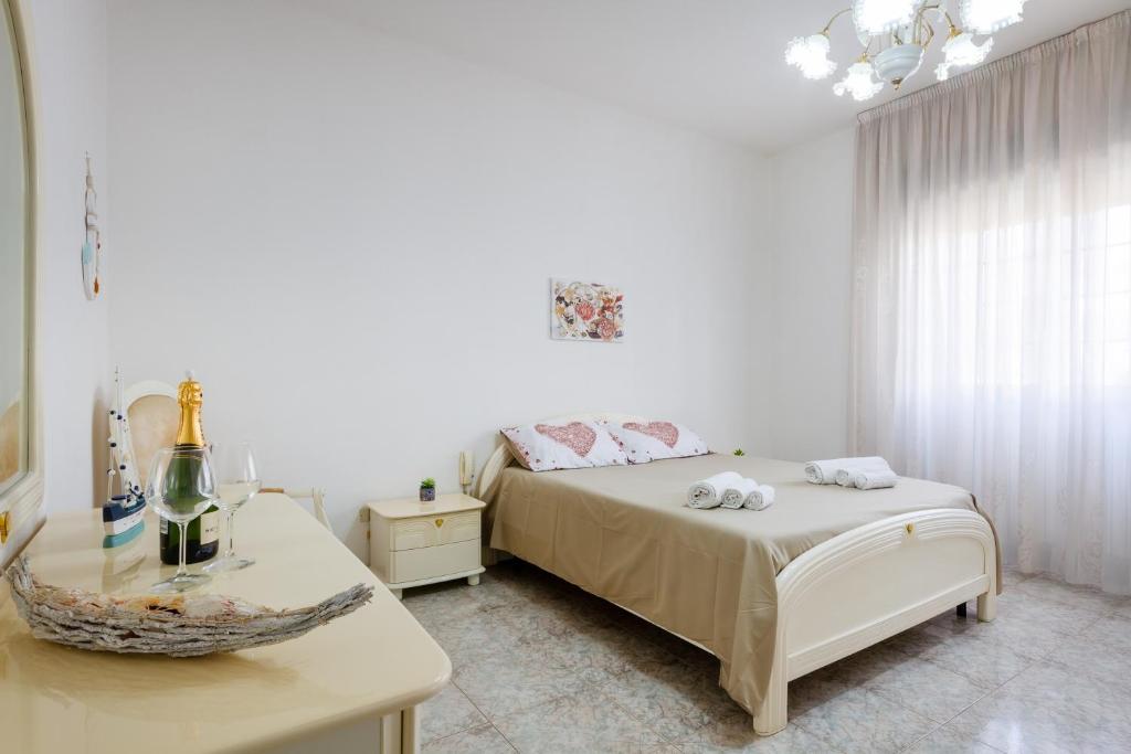 Ένα ή περισσότερα κρεβάτια σε δωμάτιο στο Villetta Sapore Di Mare