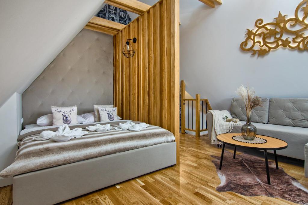 Posteľ alebo postele v izbe v ubytovaní REZYDENCJA SKIBÓWKI sauna&jacuzzi