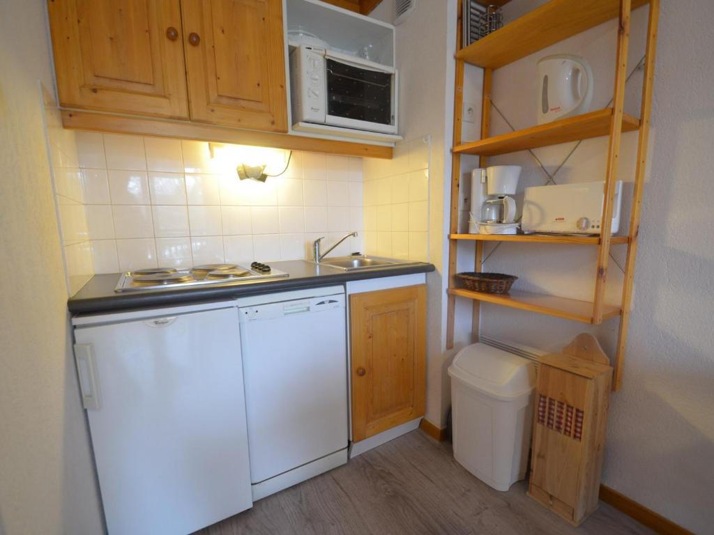 a small kitchen with a sink and a dishwasher at Appartement Les Menuires, 2 pièces, 4 personnes - FR-1-452-253 in Les Menuires