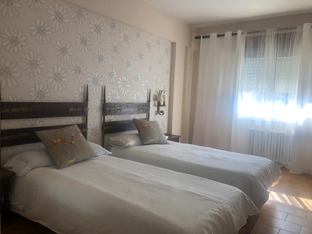 Postel nebo postele na pokoji v ubytování Hotel Barbacedo