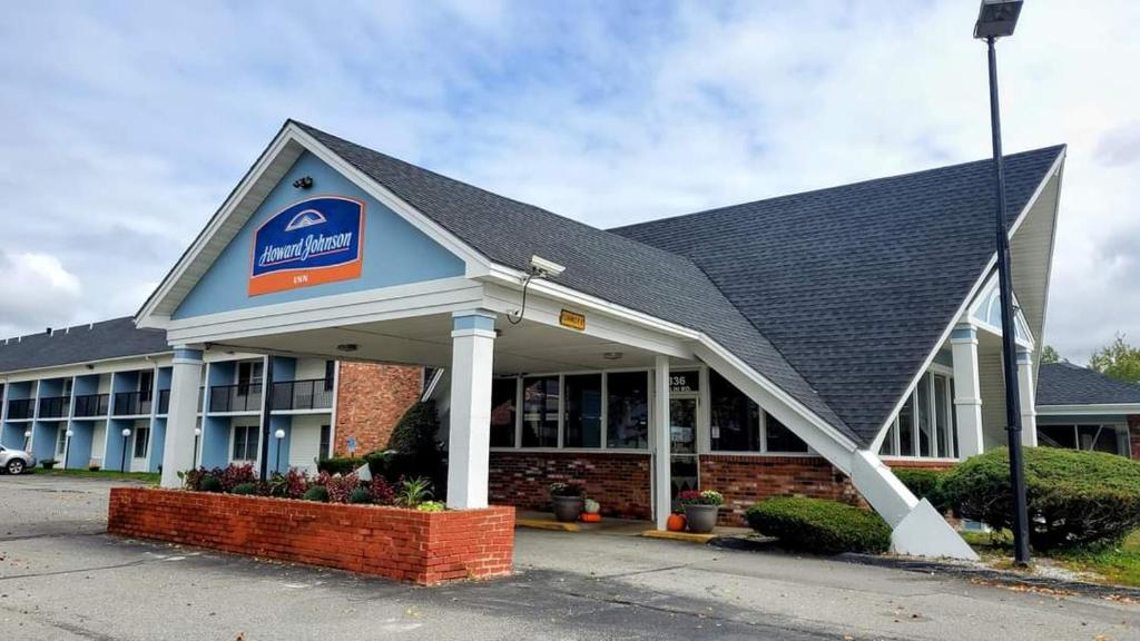 a building with a sign on the front of it at Howard Johnson by Wyndham Bangor in Bangor
