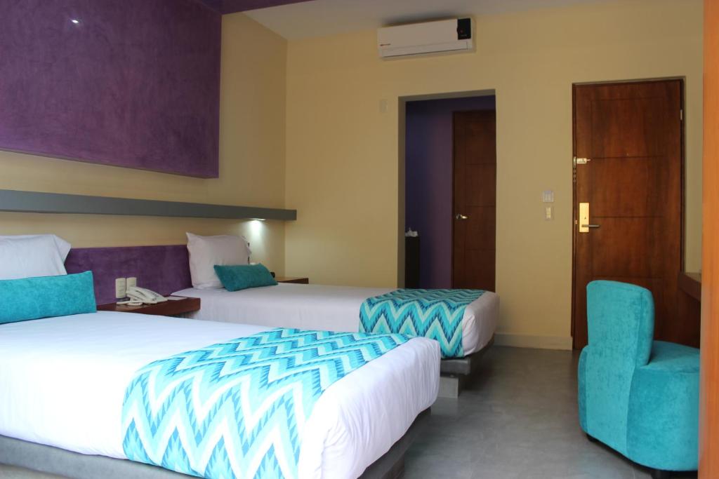 Postel nebo postele na pokoji v ubytování Orizaba Inn