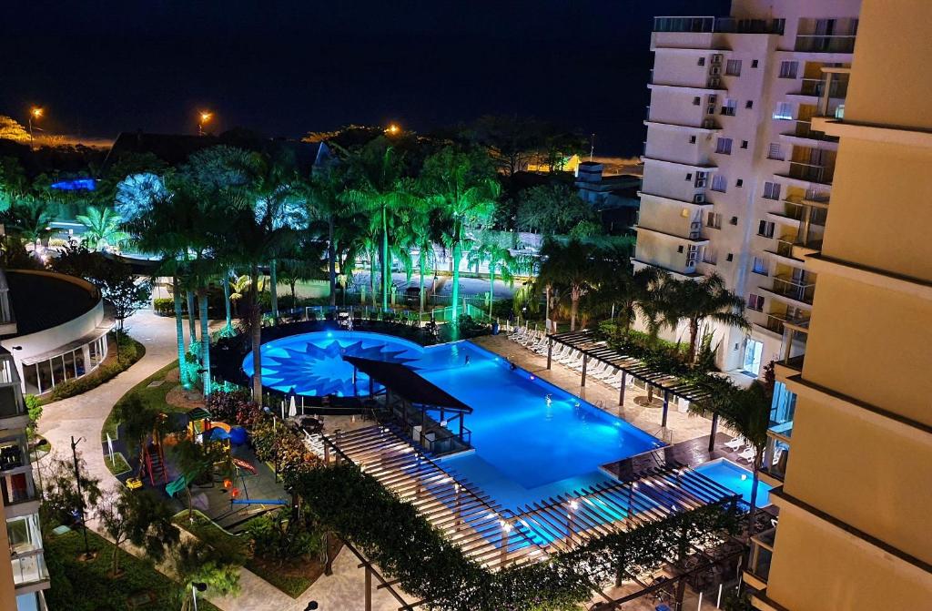 an overhead view of a swimming pool at night at Nautilus Concept - Penha/SC in Penha