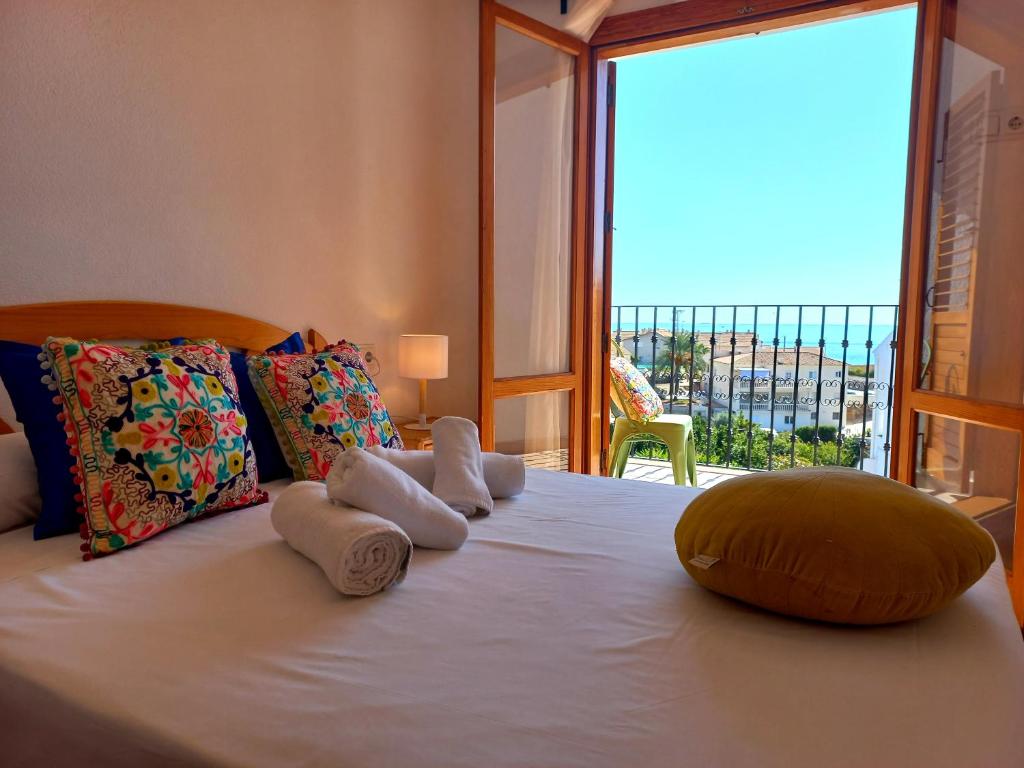 a bedroom with a bed with a view of the ocean at Altea Old Town Paraiso in Altea