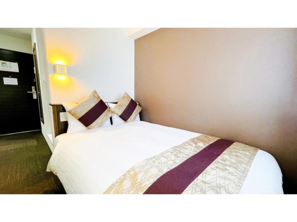 Postel nebo postele na pokoji v ubytování Eins,Inn Umeda Higashi - Vacation STAY 29928v