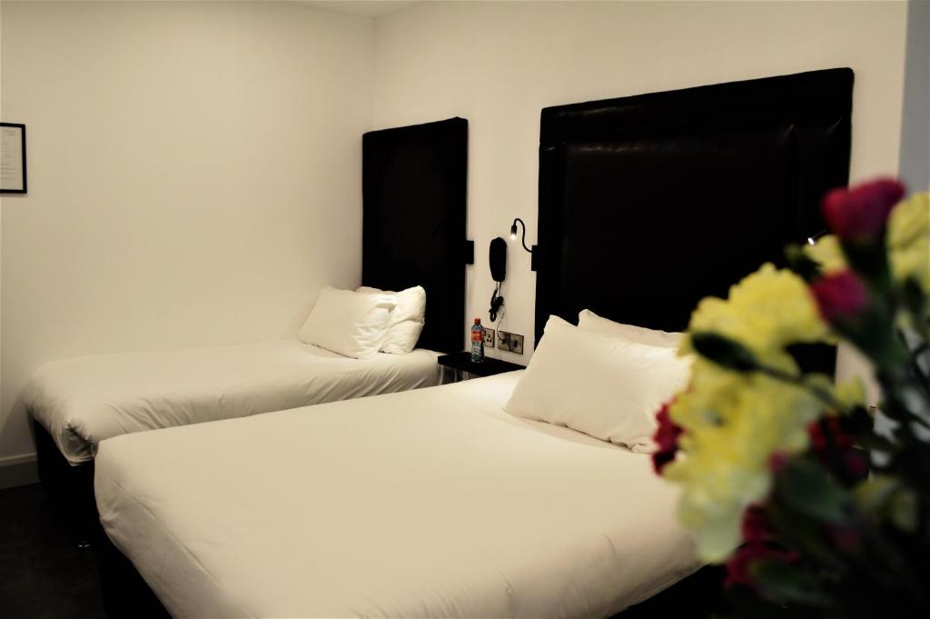 Voodi või voodid majutusasutuse Bella Vista Hotel & Self Catering Suites toas