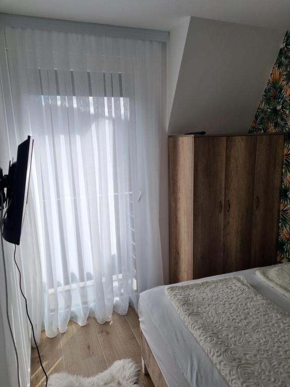 Krevet ili kreveti u jedinici u okviru objekta Apartmani Ćirić Divčibare