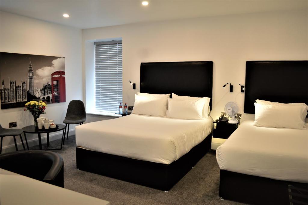 Voodi või voodid majutusasutuse Bella Vista Hotel & Self Catering Suites toas