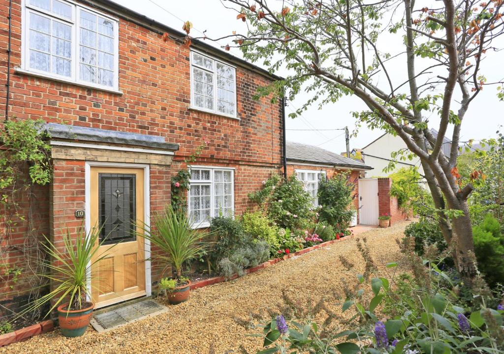 a brick house with a garden in front of it at Little Doric in Woodbridge
