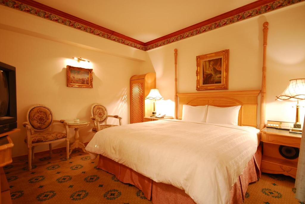 Postel nebo postele na pokoji v ubytování KaRo Hotel