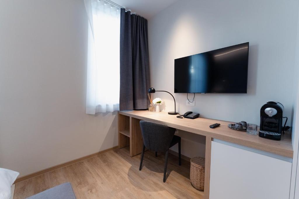 TV a/nebo společenská místnost v ubytování Vila De Casa