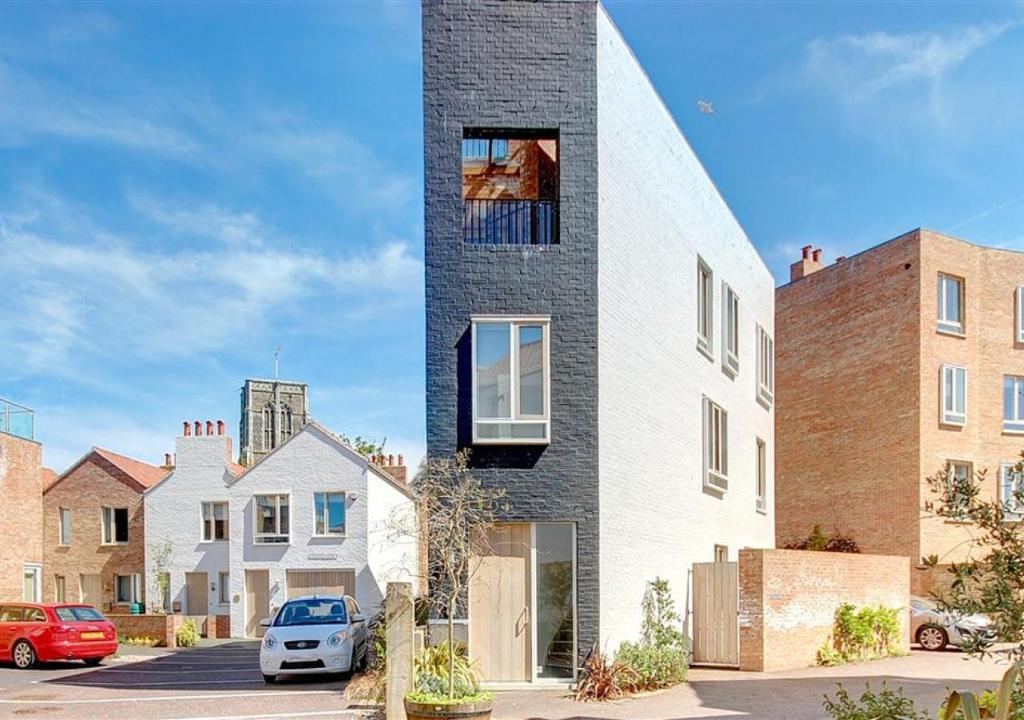 a tall building with a window on the side of it at Osprey in Southwold