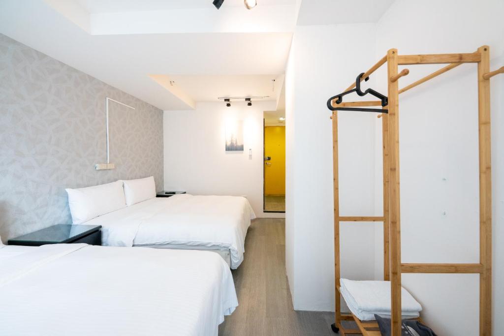 Postel nebo postele na pokoji v ubytování HotelsHere - Ximen