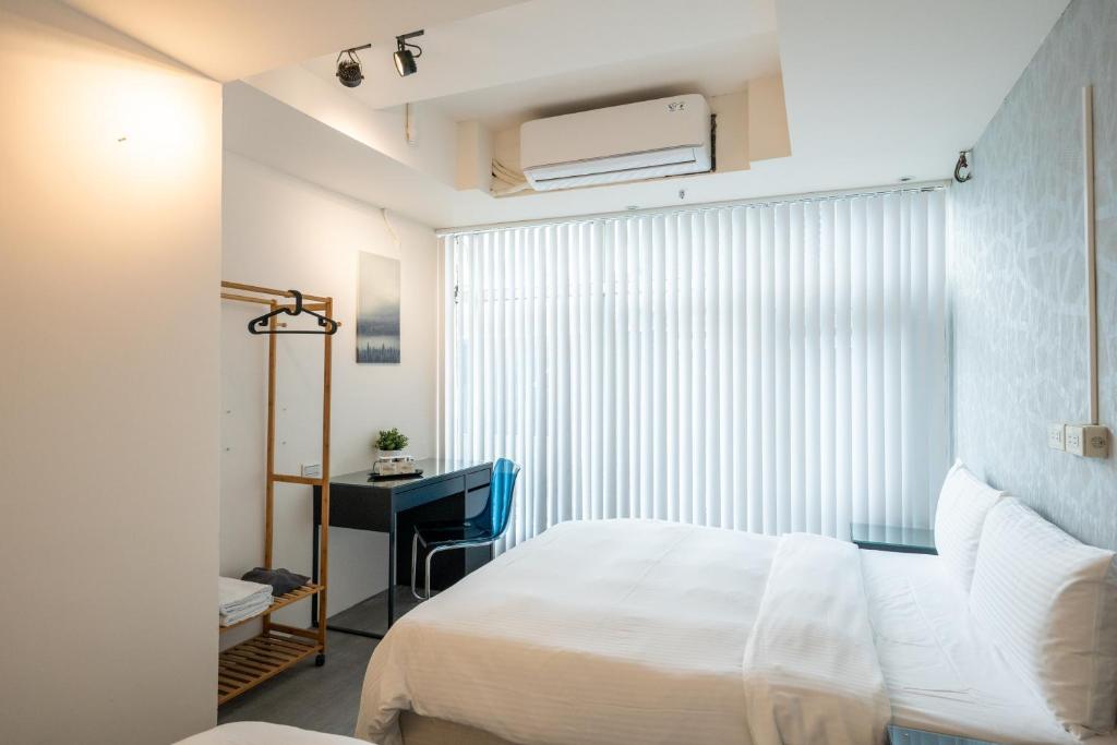 Postel nebo postele na pokoji v ubytování HotelsHere - Ximen