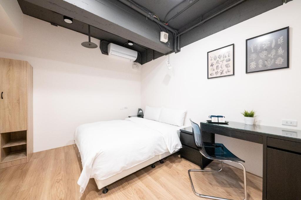 Postel nebo postele na pokoji v ubytování HotelsHere - Ximen