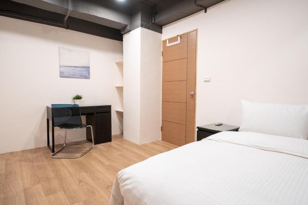 Postel nebo postele na pokoji v ubytování HotelsHere - Ximen