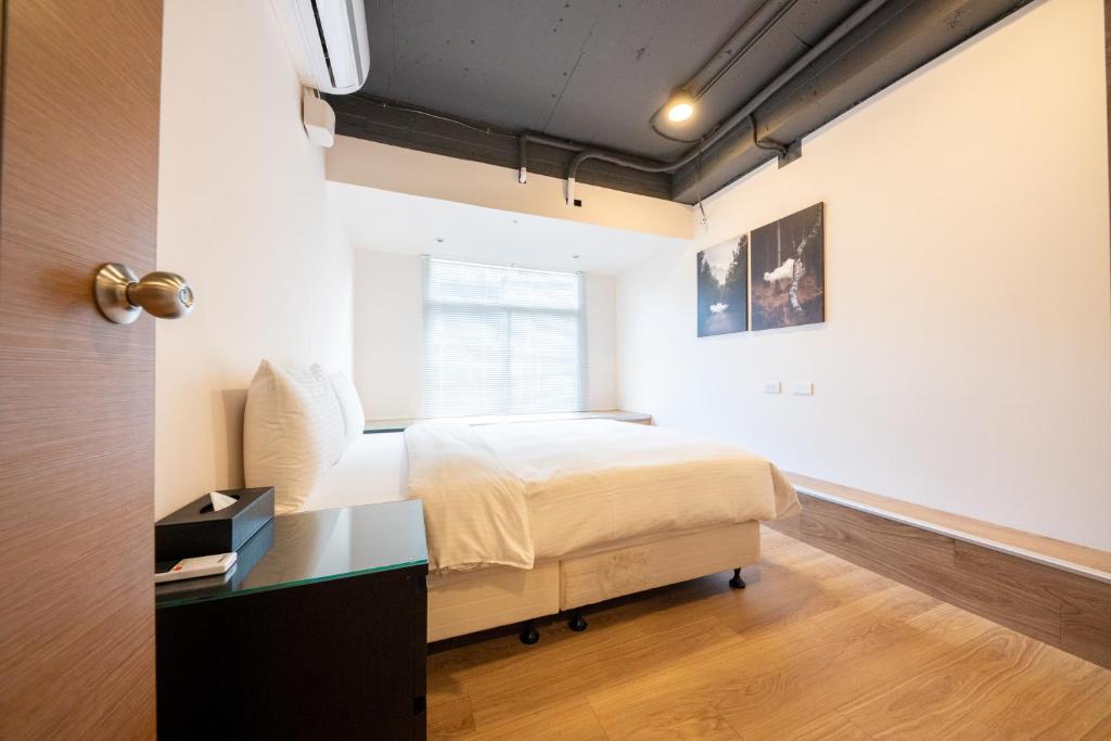 Postel nebo postele na pokoji v ubytování HotelsHere - Ximen