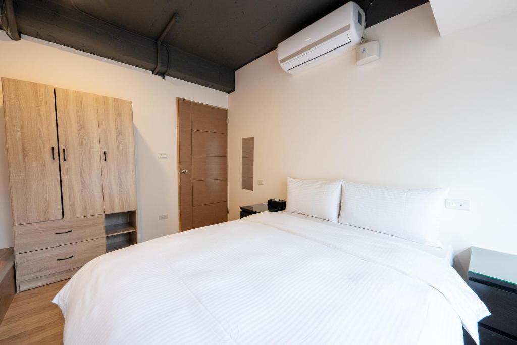 Postel nebo postele na pokoji v ubytování HotelsHere - Ximen