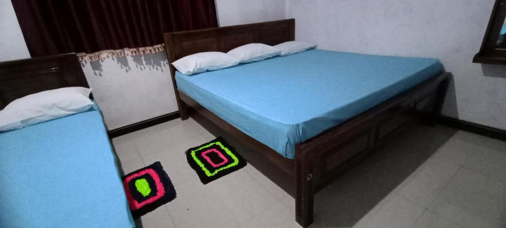 Postel nebo postele na pokoji v ubytování Serene Homestay