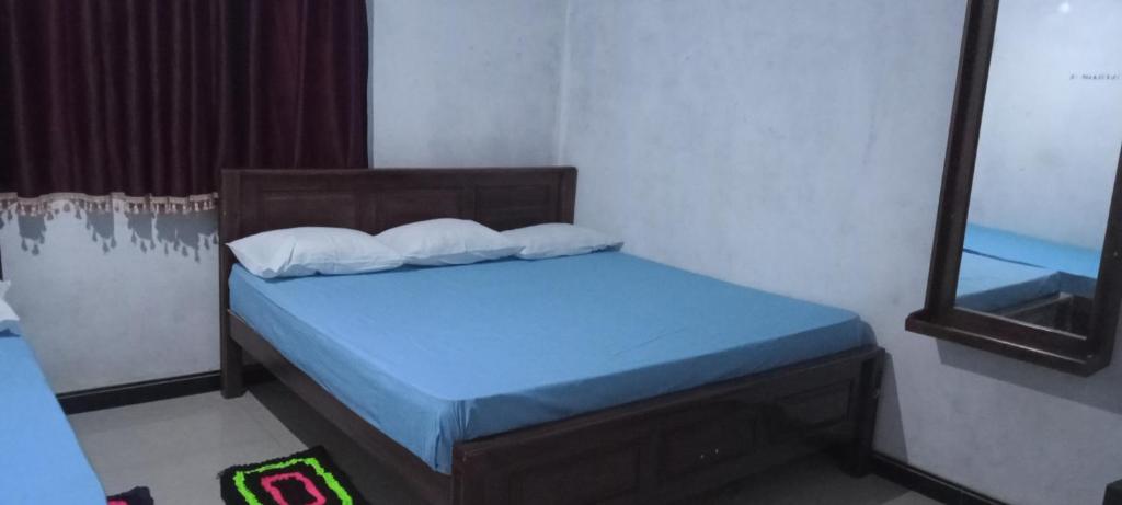 Postel nebo postele na pokoji v ubytování Serene Homestay