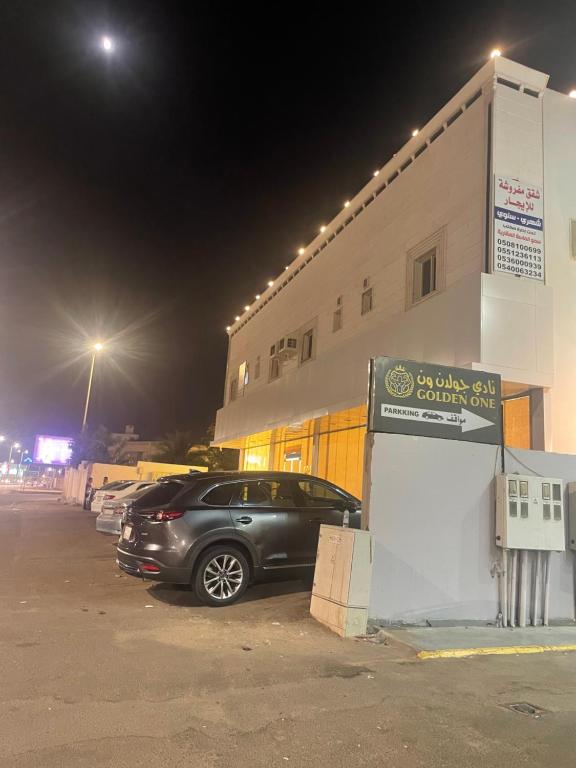 a car parked in front of a building at night at سما2 in Yanbu